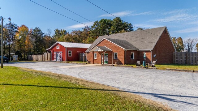 273 Riverbend Rd, Altavista, VA 24517 - ranch-style home featuring brick siding, a front lawn, and fence