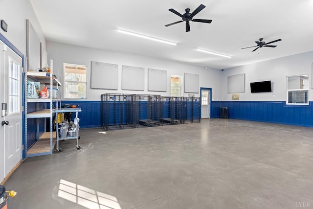273 Riverbend Rd, Altavista, VA 24517 - garage featuring a ceiling fan and wainscoting