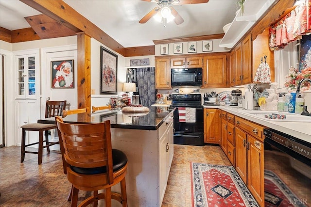 1670 Church St, Appomattox, VA 24522 - kitchen featuring a center island, sink, a kitchen bar, and black appliances