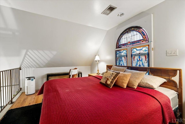 1670 Church St, Appomattox, VA 24522 - bedroom featuring lofted ceiling and wood-type flooring
