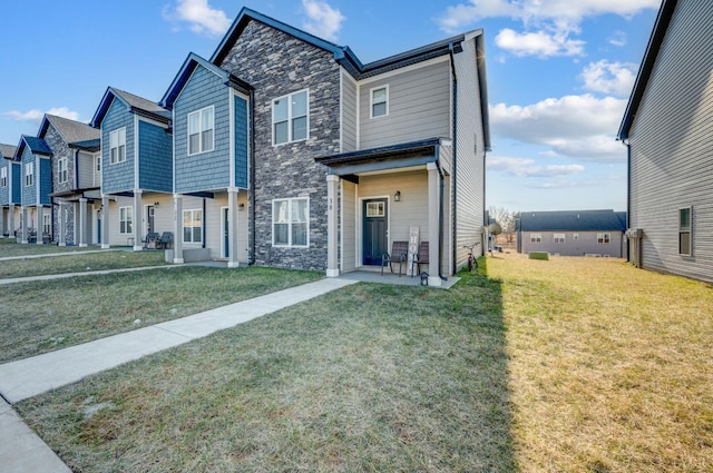 38 Emanuel Ct, Lynchburg, VA 24502 - view of front of home featuring stone siding, a front lawn, and a patio