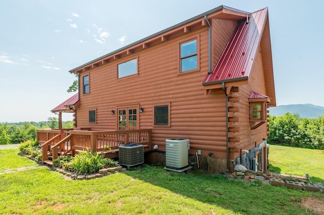2766 Camden Rd, Big Island, VA 24526 - back of house featuring a yard, a deck with mountain view, central AC unit, and french doors