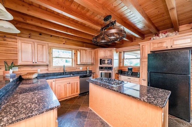 2766 Camden Rd, Big Island, VA 24526 - kitchen featuring light brown cabinetry, sink, a center island, appliances with stainless steel finishes, and pendant lighting