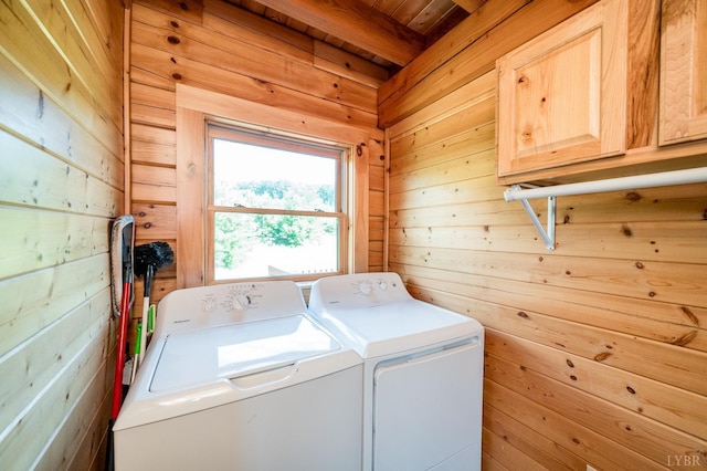 2766 Camden Rd, Big Island, VA 24526 - washroom featuring washer and dryer, cabinets, and wood walls