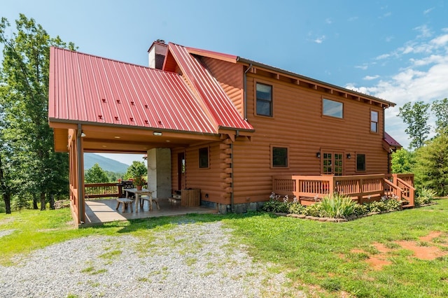2766 Camden Rd, Big Island, VA 24526 - rear view of property featuring a lawn, a patio, and a deck