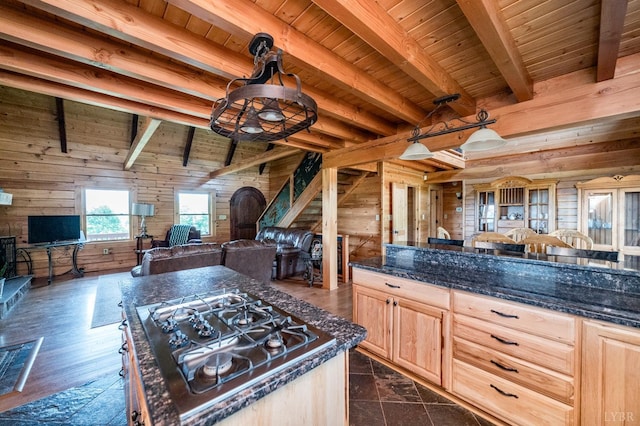 2766 Camden Rd, Big Island, VA 24526 - kitchen with wood walls, stainless steel gas stovetop, decorative light fixtures, and light brown cabinets