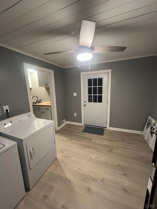 1103 Brandon Rd, Lynchburg, VA 24502 - washroom featuring crown molding, separate washer and dryer, light wood-style floors, a ceiling fan, and laundry area