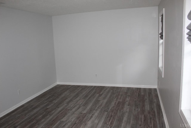 34 Cape Point Ct, Lynchburg, VA 24502 - unfurnished room with baseboards, a textured ceiling, and dark wood-style floors