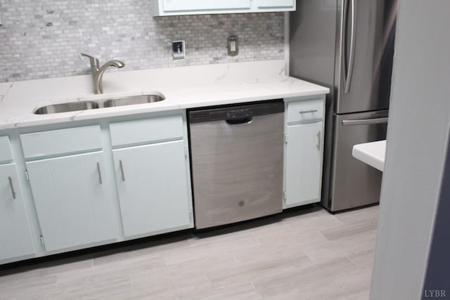 34 Cape Point Ct, Lynchburg, VA 24502 - kitchen featuring white cabinets, stainless steel appliances, a sink, and tasteful backsplash