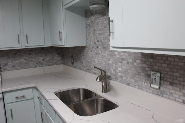 34 Cape Point Ct, Lynchburg, VA 24502 - kitchen with white cabinetry, light stone counters, and a sink