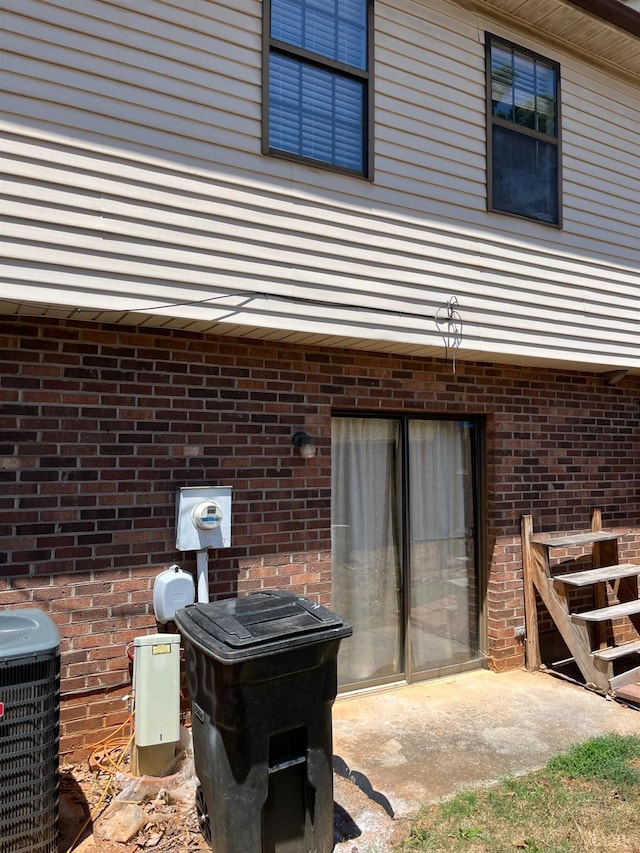 34 Cape Point Ct, Lynchburg, VA 24502 - doorway to property with brick siding and central AC