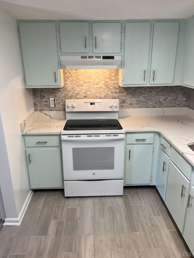 34 Cape Point Ct, Lynchburg, VA 24502 - kitchen featuring light stone countertops, light wood finished floors, tasteful backsplash, under cabinet range hood, and white electric range