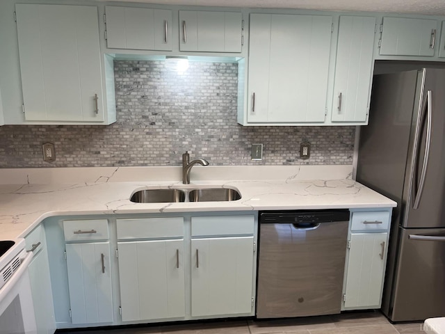 34 Cape Point Ct, Lynchburg, VA 24502 - kitchen with a sink, appliances with stainless steel finishes, decorative backsplash, and light stone counters