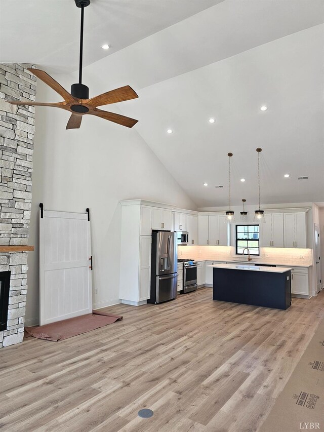 18 Grandset Dr, Forest, VA 24551 - living room with light wood-style floors, ceiling fan, high vaulted ceiling, recessed lighting, and a fireplace