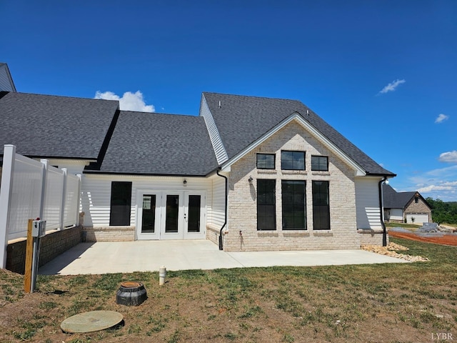 18 Grandset Dr, Forest, VA 24551 - back of property featuring french doors, a patio area, roof with shingles, and stone siding