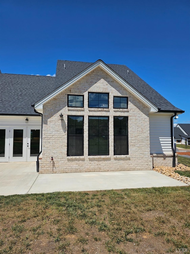 18 Grandset Dr, Forest, VA 24551 - rear view of house featuring a patio, roof with shingles, french doors, and a lawn