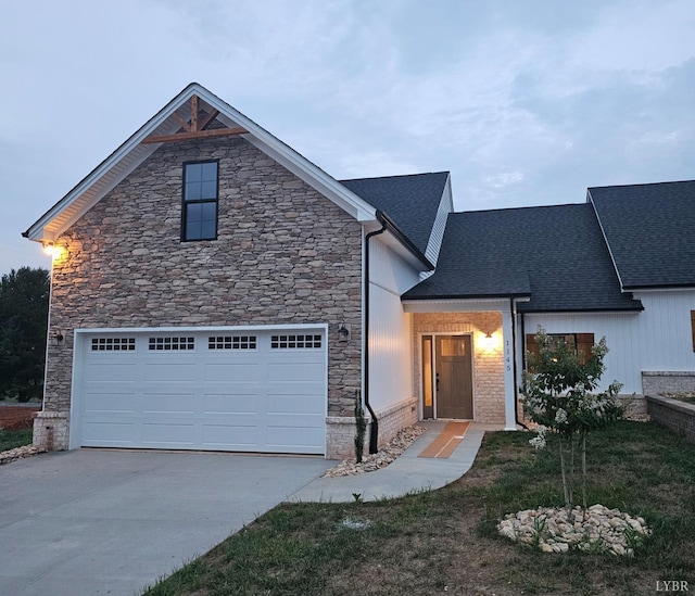 18 Grandset Dr, Forest, VA 24551 - view of front of property with stone siding, driveway, roof with shingles, and a garage