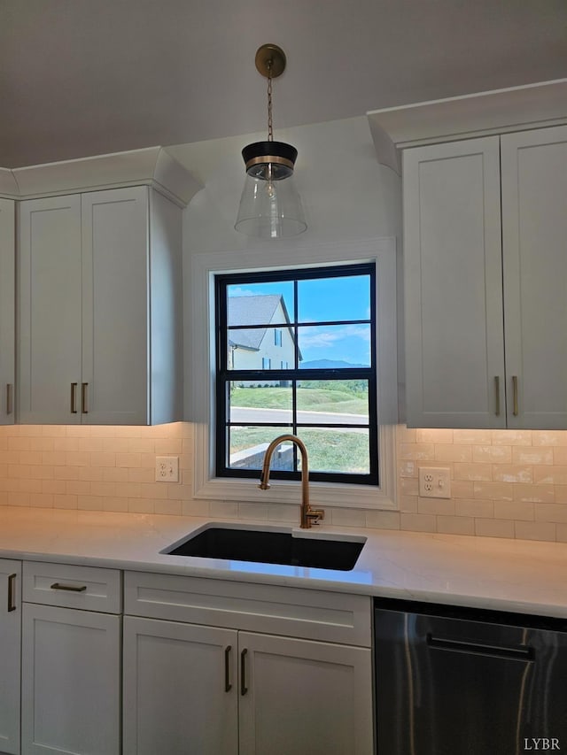 18 Grandset Dr, Forest, VA 24551 - kitchen with dishwashing machine, a sink, white cabinets, and backsplash
