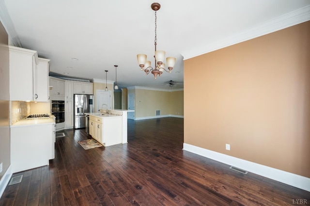 1060 Governors Ln, Forest, VA 24551 - kitchen with stainless steel appliances, a sink, ornamental molding, a chandelier, and open floor plan