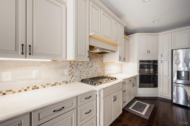 1060 Governors Ln, Forest, VA 24551 - kitchen featuring appliances with stainless steel finishes, light countertops, dark wood-style flooring, tasteful backsplash, and recessed lighting