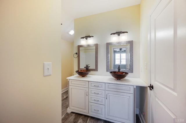 1060 Governors Ln, Forest, VA 24551 - bathroom featuring wood finished floors, double vanity, and baseboards