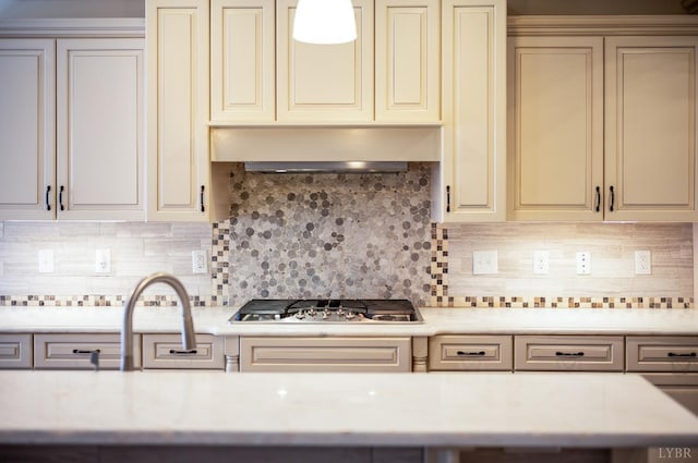 1060 Governors Ln, Forest, VA 24551 - kitchen with cream cabinets, stainless steel gas stovetop, light countertops, exhaust hood, and a sink