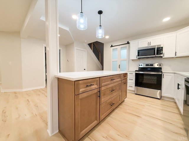 13273 Leesville Rd, Lynch Station, VA 24571 - kitchen featuring light wood finished floors, stainless steel appliances, white cabinets, pendant lighting, and light countertops