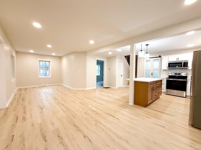 13273 Leesville Rd, Lynch Station, VA 24571 - kitchen with recessed lighting, light wood finished floors, stainless steel appliances, light countertops, and open floor plan