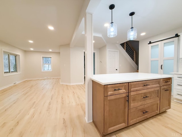 13273 Leesville Rd, Lynch Station, VA 24571 - kitchen featuring open floor plan, light wood-style flooring, light countertops, and hanging light fixtures
