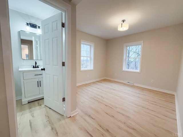 13273 Leesville Rd, Lynch Station, VA 24571 - interior space featuring light wood finished floors, baseboards, a wealth of natural light, and visible vents