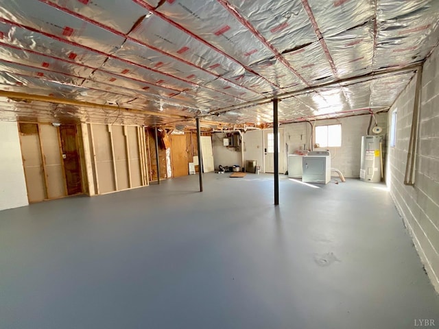 143 Lake Dr, Amherst, VA 24521 - below grade area with water heater, washer / dryer, and concrete block wall