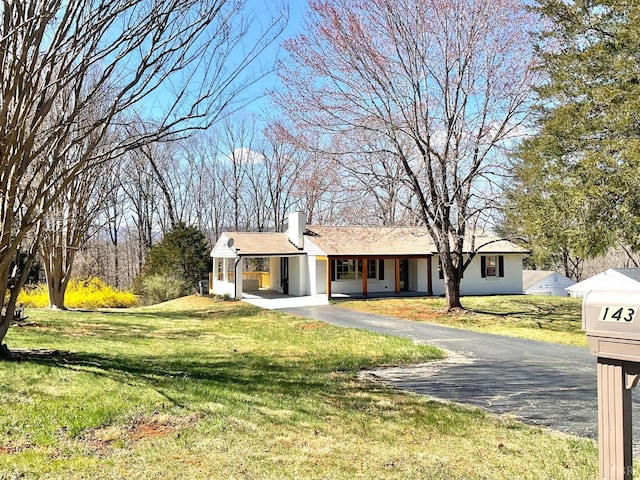 143 Lake Dr, Amherst, VA 24521 - view of front of home with a chimney, a front yard, asphalt driveway, and an attached carport