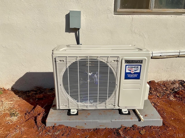 143 Lake Dr, Amherst, VA 24521 - exterior view of stucco siding and a cooling unit