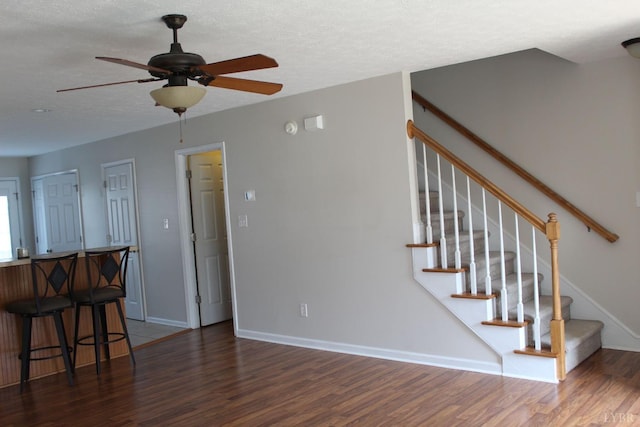 224 Duncraig Dr, Lynchburg, VA 24502 - stairway featuring wood finished floors, a ceiling fan, baseboards, and a textured ceiling