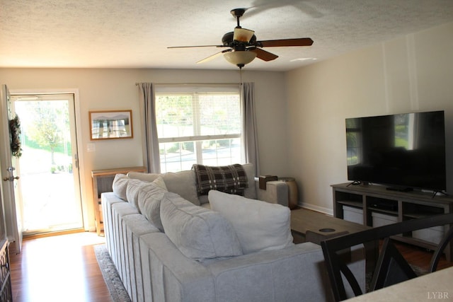 224 Duncraig Dr, Lynchburg, VA 24502 - living area featuring a ceiling fan, a textured ceiling, and dark wood-type flooring