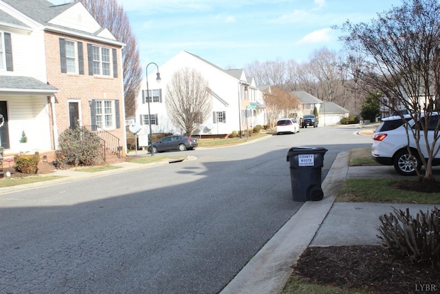 224 Duncraig Dr, Lynchburg, VA 24502 - view of asphalt road featuring a residential view, curbs, street lighting, and sidewalks