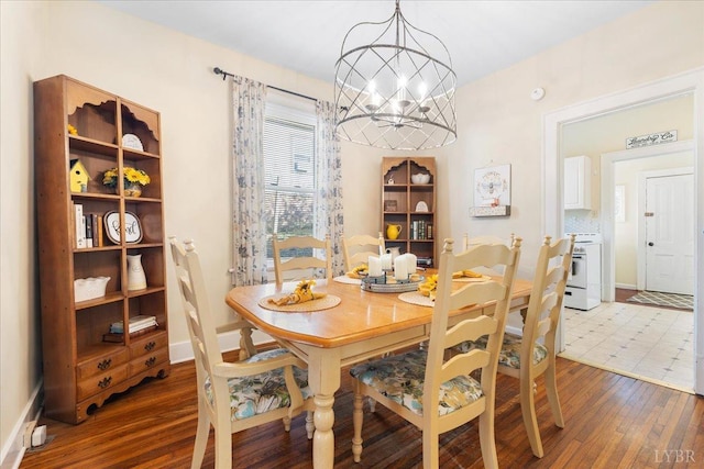 211 Warren Ave, Lynchburg, VA 24501 - dining space featuring baseboards, an inviting chandelier, and wood finished floors
