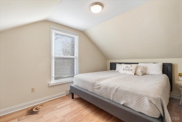 211 Warren Ave, Lynchburg, VA 24501 - bedroom featuring baseboards, light wood-style flooring, and vaulted ceiling