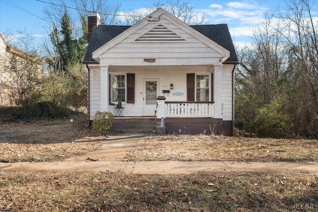 211 Warren Ave, Lynchburg, VA 24501 - bungalow with covered porch, a chimney, and roof with shingles