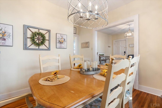 211 Warren Ave, Lynchburg, VA 24501 - dining room featuring a chandelier, baseboards, and wood finished floors