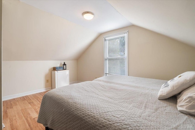 211 Warren Ave, Lynchburg, VA 24501 - bedroom featuring baseboards, lofted ceiling, and light wood finished floors
