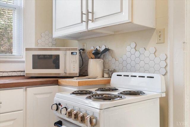 211 Warren Ave, Lynchburg, VA 24501 - kitchen with white cabinetry, white appliances, tasteful backsplash, and wooden counters
