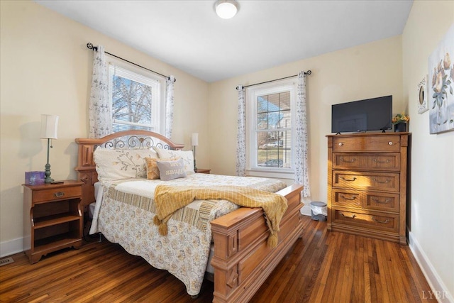 211 Warren Ave, Lynchburg, VA 24501 - bedroom featuring multiple windows, baseboards, and dark wood-style flooring