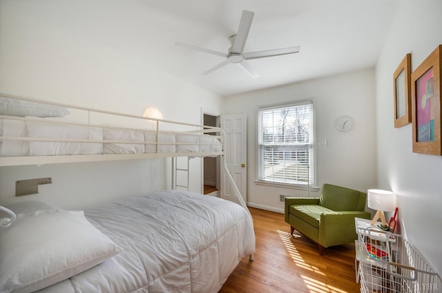 bedroom featuring wood finished floors and a ceiling fan