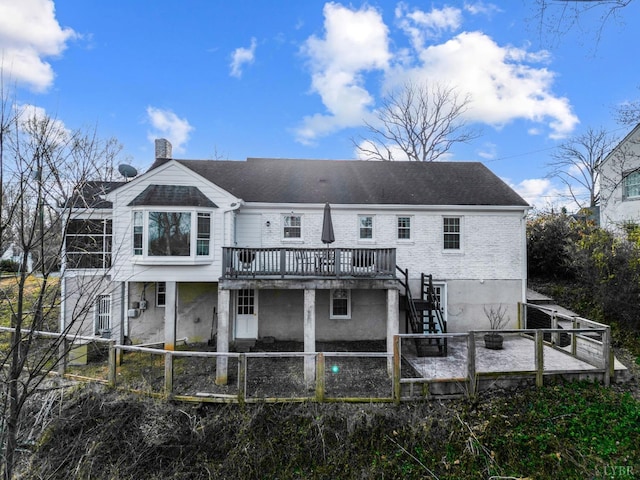 back of property with a patio, stairs, a chimney, and a fenced backyard