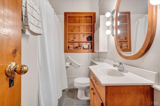 full bathroom featuring toilet, tile patterned flooring, vanity, and curtained shower