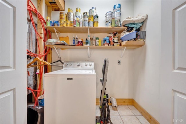 laundry area with washer / dryer and baseboards