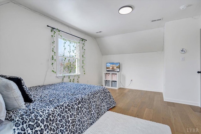 268 Leftwich Rd, Madison Heights, VA 24572 - bedroom featuring wood finished floors, lofted ceiling, and baseboards