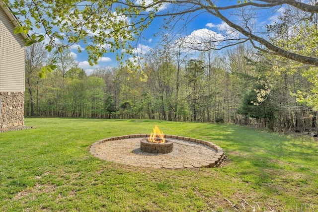 268 Leftwich Rd, Madison Heights, VA 24572 - view of green lawn with a fire pit and a view of trees