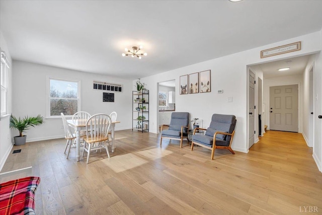 268 Leftwich Rd, Madison Heights, VA 24572 - dining area featuring light wood finished floors, plenty of natural light, a chandelier, and baseboards